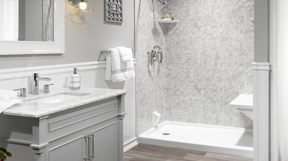 Modern blue house with large windows at dusk.