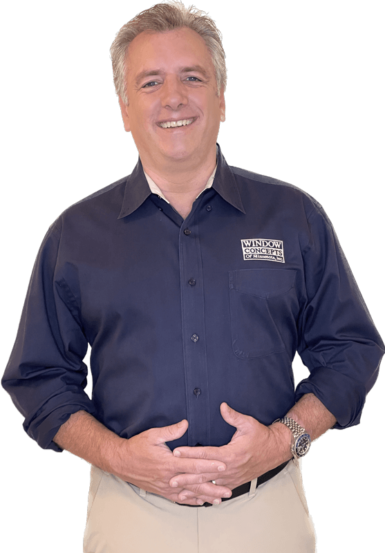 Smiling person in branded uniform shirt.